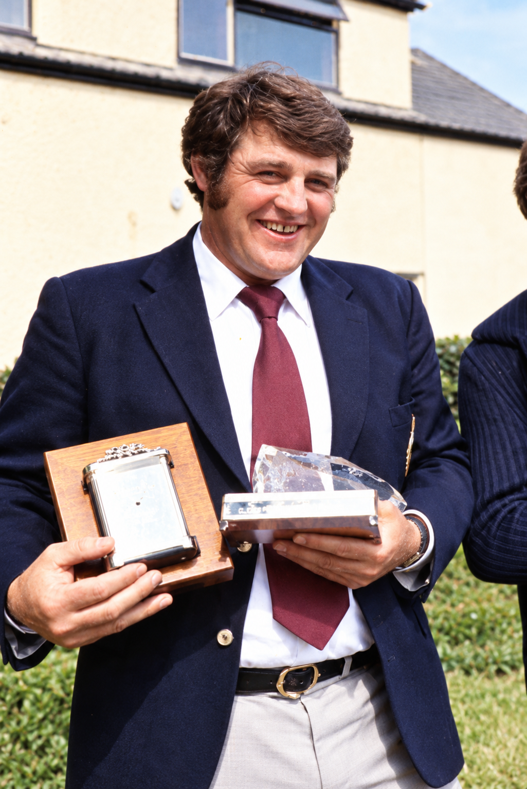 Kevin Ashurst holding awards during his early competitive career